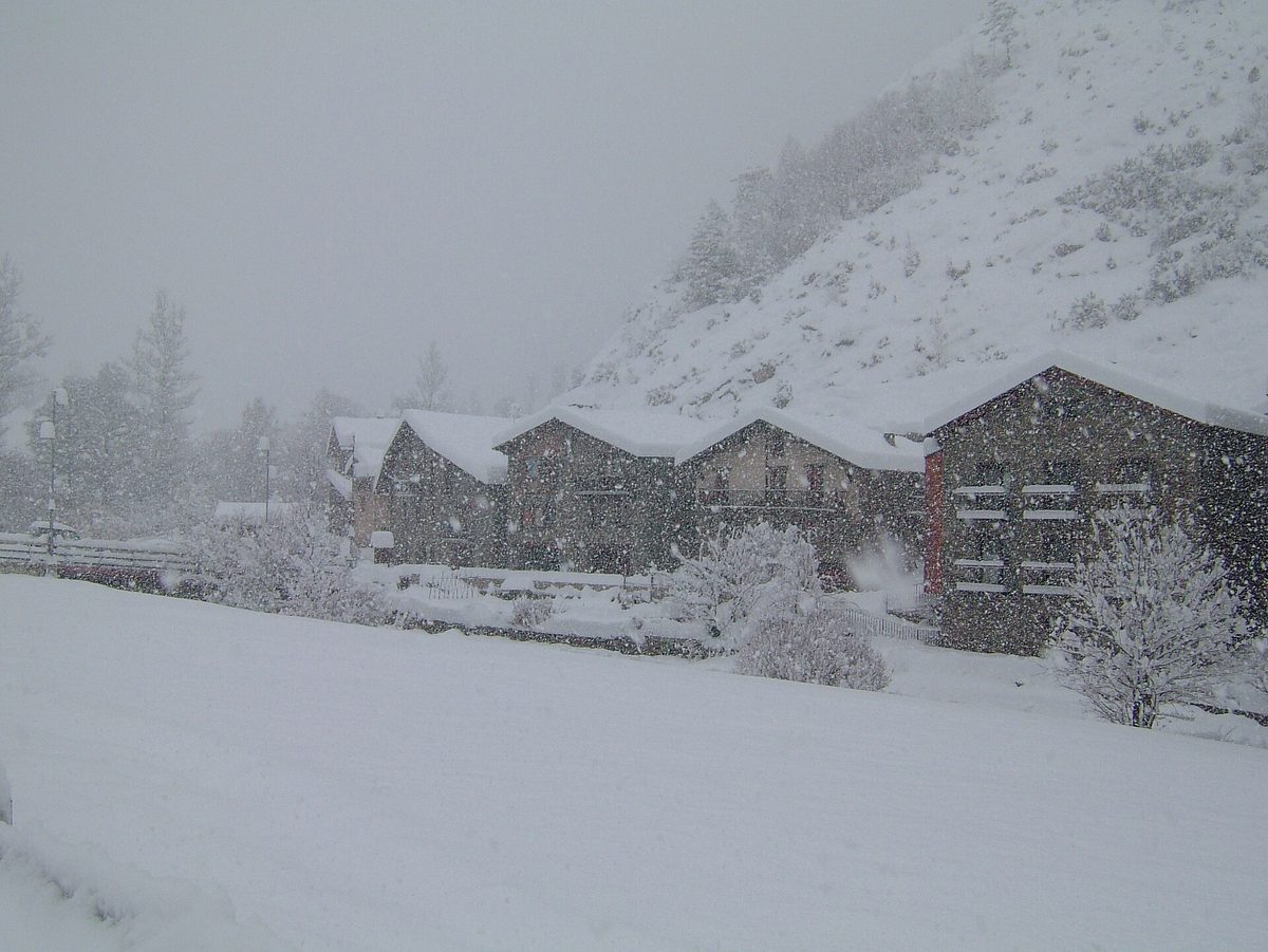 Heavy snow falling on a mountain hamlet near Ordino, in Andorra's quiet northern parishes