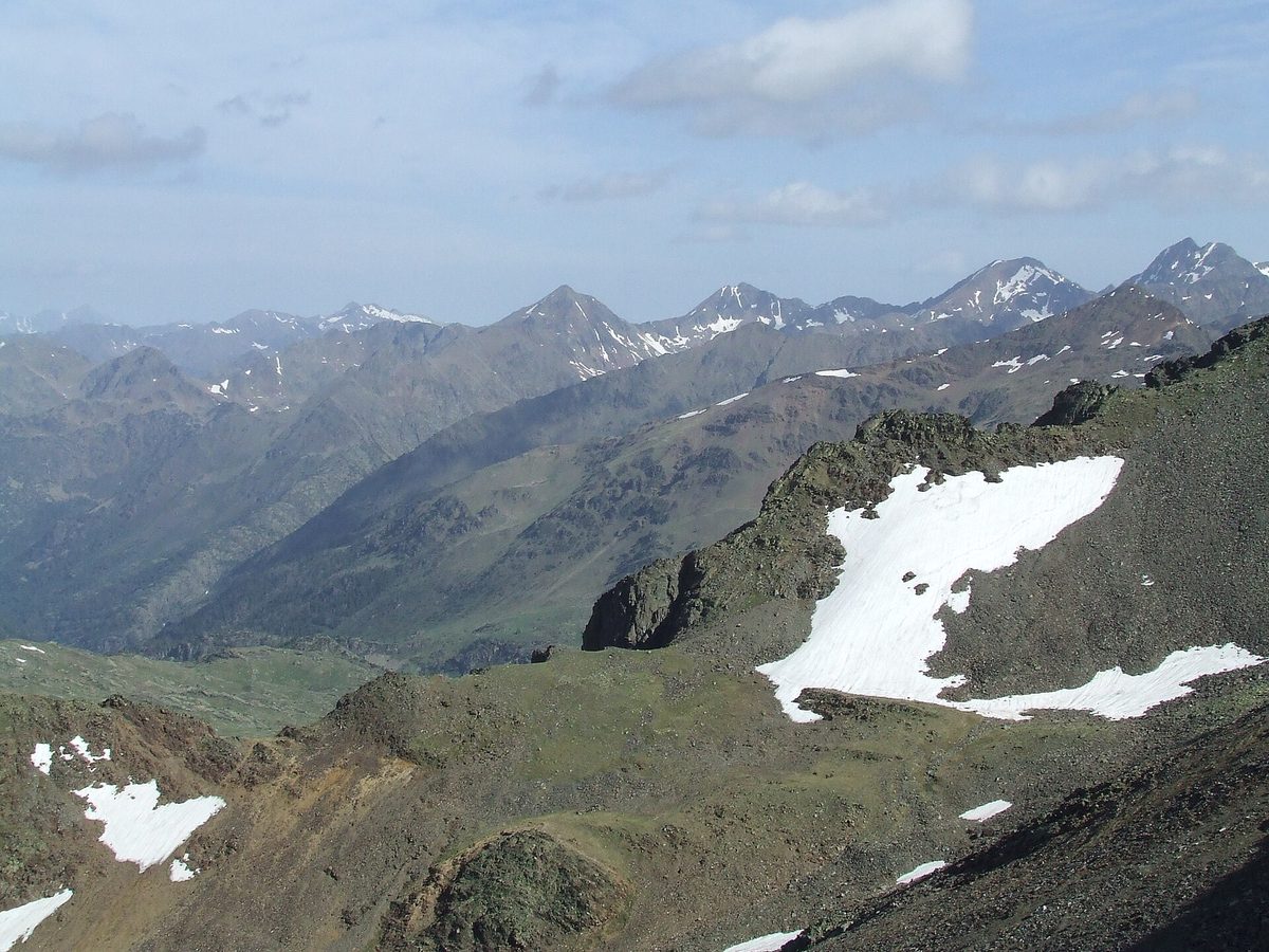 High ridges and late-season snow near Portella de Baiau in the Comapedrosa Valleys Natural Park - the toughest hiking in Andorra