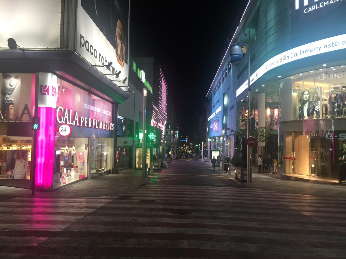 The pedestrianised lower end of Avinguda Meritxell after dark - perfume and fashion all the way to the Escaldes line