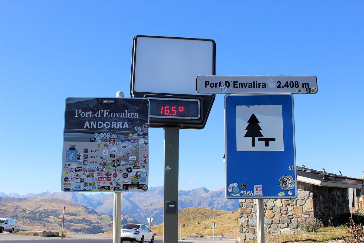 Summit signs at the 2,408 m Port d'Envalira, the highest paved pass in the Pyrenees, on the road to Pas de la Casa