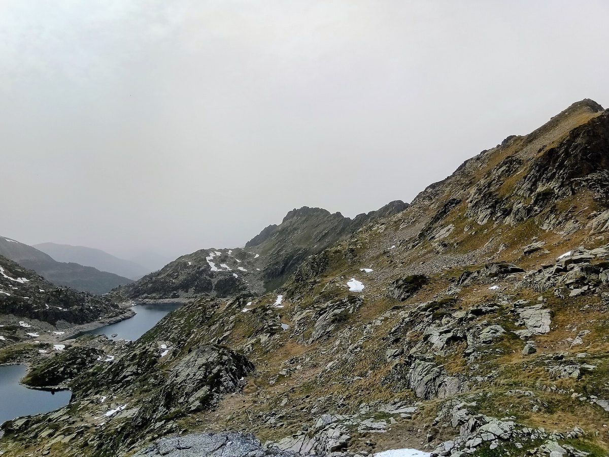 The high Juclar lakes ringed by rocky peaks in the Andorran Pyrenees