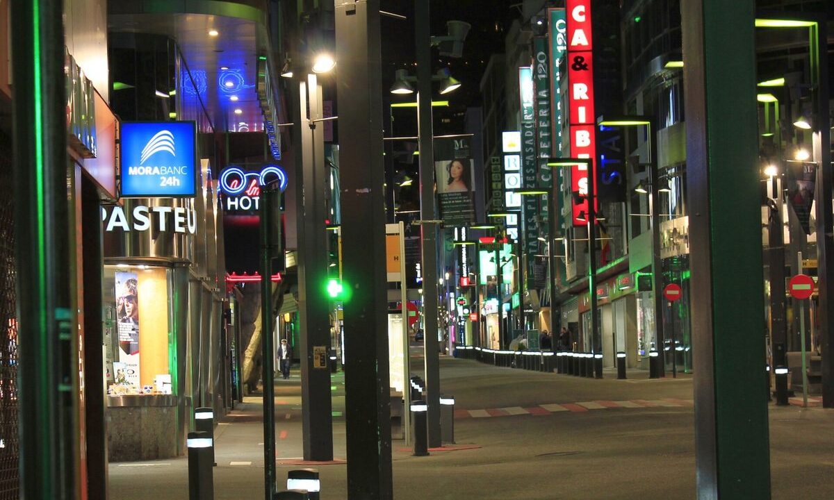 Avinguda Meritxell in Andorra la Vella lit by neon signs at night