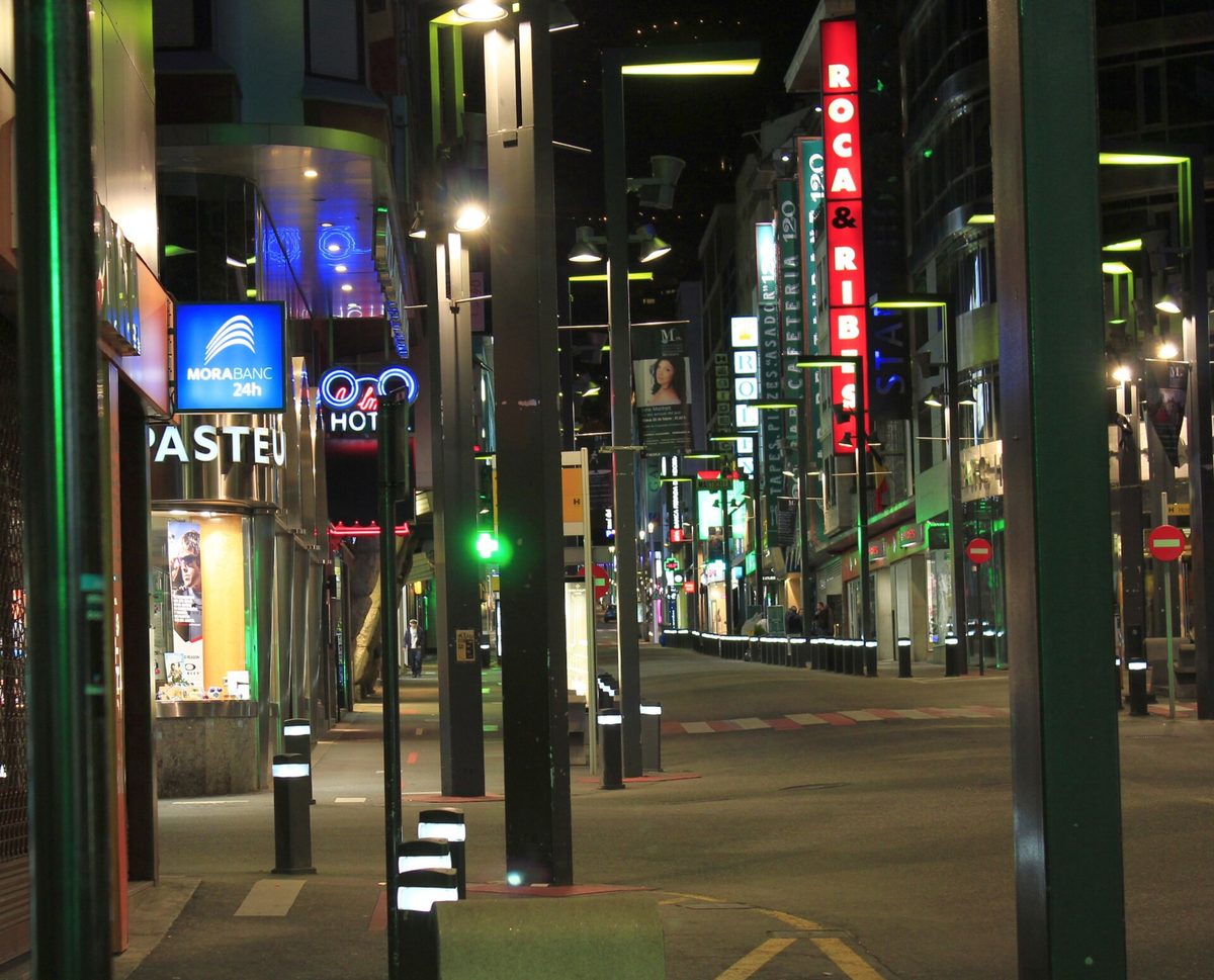 Avinguda Meritxell in Andorra la Vella lit by neon signs at night