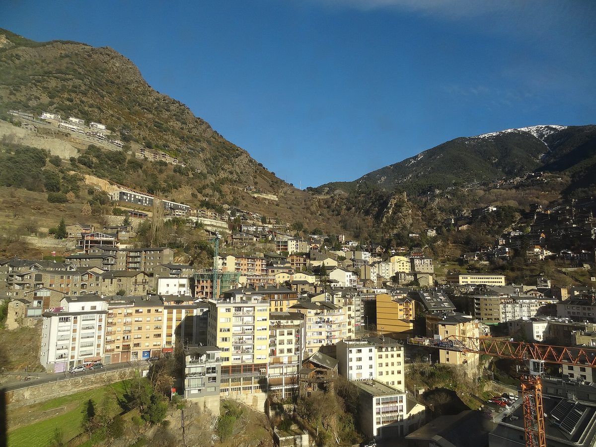 View from the Caldea tower over the apartment blocks of Andorra la Vella, with snow-dusted ridges above the valley