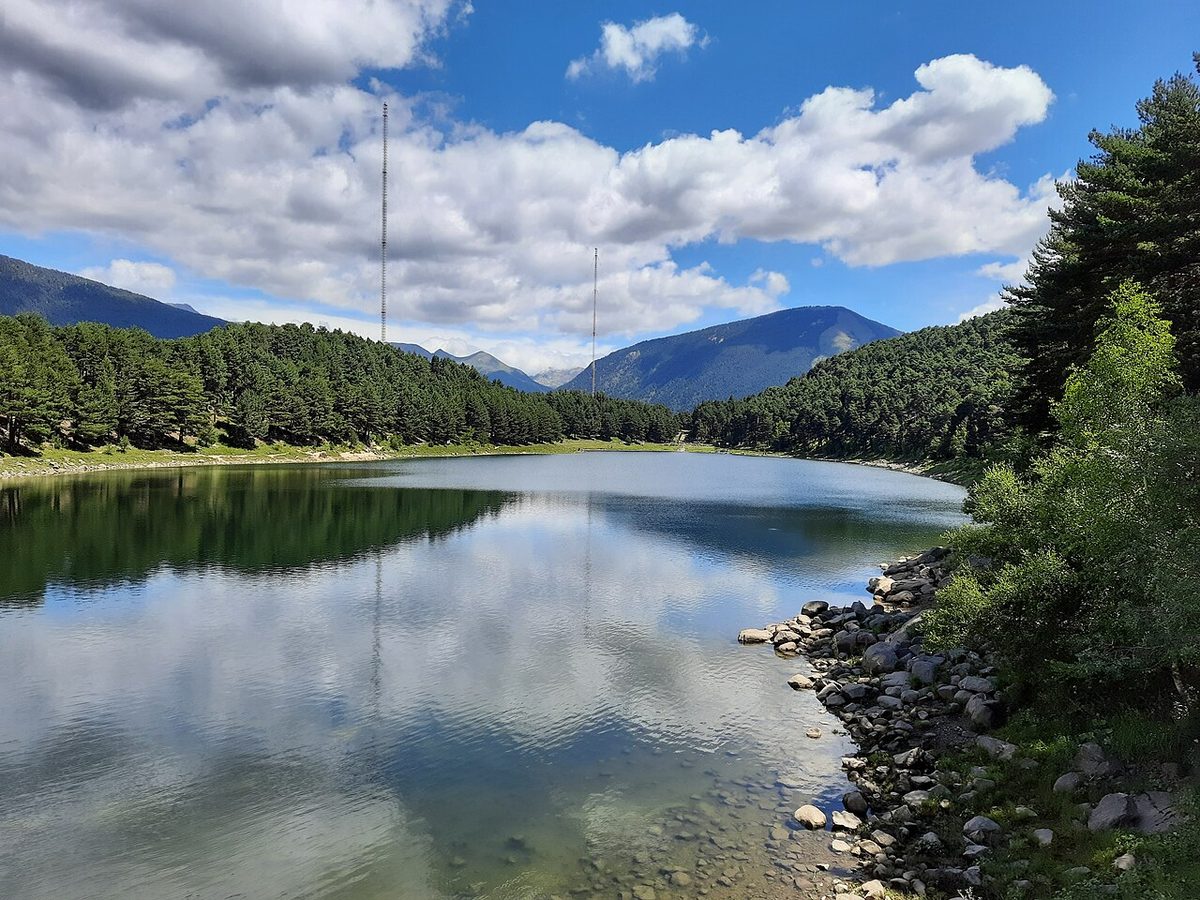 Lake Engolasters, the pine-ringed reservoir on the plateau above Encamp, Andorra